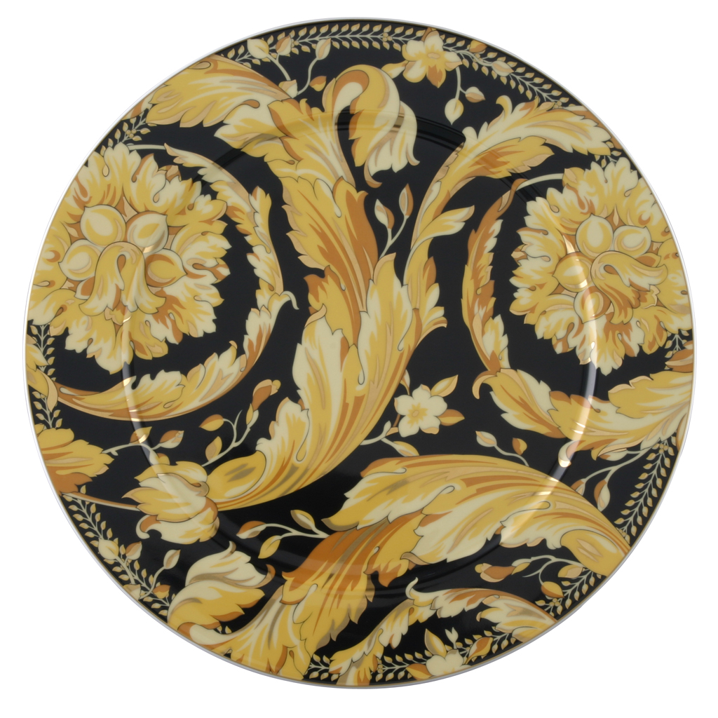 Vanity è il motivo più conosciuto di Versace ed è un disegno originale del leggendario Gianni Versace. Ciò che ha già ottenuto successo nel mondo della moda e dell'arredamento viene ora riprodotto su porcellana pregiata. Il nuovo servizio "Vanity"della collezione "Ikarus" è un must-have per tutti gli appassionati della tipica opulenza Versace. La decorazione con la tipica combinazione di colori blu scuro e oro rivive attraverso un servizio e ad esclusivi articoli da regalo come vasi e coppe, ricordando i preziosi lavori di intarsio effettuati su mobili barocchi. Un portacandela in titanio completa l'assortimento e sottolinea ancora una volta il tipico carattere Versace della collezione.